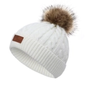 White cable knit beanie for children featuring a brown faux fur pom pom and leather patch - White