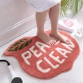 Peach shaped non-slip plush bathroom mat in pink with Peach Clean text design - Peach Shape
