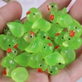 Handful of green luminous resin ducklings for DIY crafts and miniature decorations - Fluorescent Green