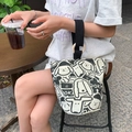 Canvas bucket bag with cartoon dog prints and wooden ring handle in black and white - OK Doggy