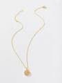 Close-up of a gold sunflower pendant with sparkling cubic zirconia on a delicate chain - Gold