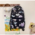 Detailed view of black student backpack with moon and star prints hanging on a hook - 28*15*43cm / Black