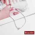 Bracciale minimalista in acciaio inossidabile oro rosa con un singolo zircone brillante - Bracciale / Oro rosa