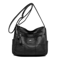 Minimalist black crossbody bag with lychee grain leather and functional zippers - Black