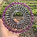 Detailed view of vintage silver metal wall decor with engraved patterns and purple gems - Retro Silver Rose Red Rhinestone