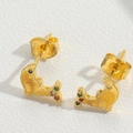 Golden dolphin stud earrings with multicolor crystal accents on white leather background - Dolphin / Gold/Multicolor Zirconia