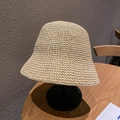 Elegant beige straw cloche bucket hat with fine woven texture displayed on a stand - One Size / Solid Color Bucket Hat - Beige