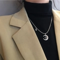 Detail of silver crescent moon and star pendant on a long layered sweater necklace - Star Moon Necklace