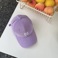 Detail of light purple baseball cap with white embroidered CC letters on cotton fabric - Purple