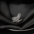 Macro shot of silver feather ring with micro-pave diamonds on black silk background - Adjustable Open / Silver Zirconia Feather