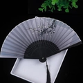 Grey-purple Chinese folding fan with ink plum blossom pattern and black bamboo ribs - Ink White Plum Blossom