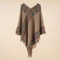 Detail showing the intricate fringe hem and colorful patterned trim of the brown poncho wrap - Diamond Khaki