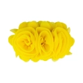 Close-up of yellow chiffon flower accessory with delicate layered fabric petals - Yellow