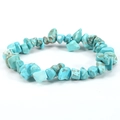 Macro detail of irregular turquoise stone beads with natural brown veins on elastic bracelet - Turquoise