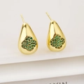 Macro shot of gold teardrop earrings featuring a four-leaf clover with green zircon inlay - Green