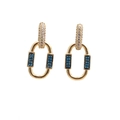 Detail of gold geometric earrings featuring white pave crystals and blue rectangular stones - Light Blue Zircon