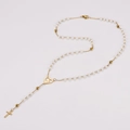 Detailed close-up of beaded pearl necklace with golden cross pendant and heart charm - 50cm / White