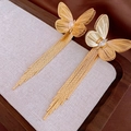 Detail of gold butterfly tassel earrings with zircon stones on a rustic linen tray - Gold Butterfly Rhinestone Tassel (11#)