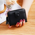 Minimalist black square wallet with lychee pattern and tassel pendant detail - Black