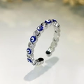 Macro detail of the evil eye ring with blue enamel and sparkling cubic zirconia stones - Silver - Sapphire Blue
