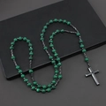 Green malachite beads necklace with metal cross pendant on dark background - 8mm Green Malachite