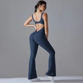 Detail view of backless deep blue jumpsuit with ruched butt and flared leg details - S / Navy Blue