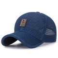 Navy blue breathable mesh baseball cap with a brown leather patch and curved visor - Adjustable / Blue