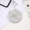 Portable round acetate makeup mirror with white pearlescent marble finish and gold text - Marble White