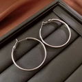 Classic silver-plated round hoop earrings with polished finish on black leather base - Silver Simple Smooth Round Hoop Earrings (49#)