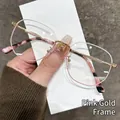 Roségoldene Metallbrille G95-282 mit strukturierten Acetatbügeln für Damen - Roségold