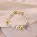 Elegant gold and white pearl bracelet with a sparkling crystal paved magnetic clasp - White Butterfly Queen Type B (2422) / 17.5cm