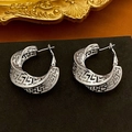 Detail view of silver C-shaped earrings with twisted Greek key pattern on black surface - 61# Silver Earring Post - Silver - Greek Key Pattern Hoop