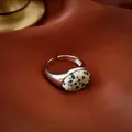 Macro shot of silver adjustable open ring with spotted oval gemstone on satin background - Spotted Oval Gemstone (31#)