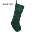 Detail of small dark green knitted Christmas stocking with wave pattern and hanging loop - Small Green