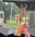 Close-up of pink and beige crochet lily of the valley hanging on a car rearview mirror - Light Yellow Four Flowers
