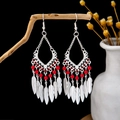 Ethnic silver-tone drop earrings with vibrant red beads and feather tassels on a branch - Silver Red Feather Tassel Hook(E5245-1)