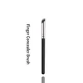 Detail of angled concealer brush with dense synthetic bristles and matte black handle - Finger Concealer Brush