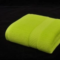 Vivid bright green cotton bath towel with textured diamond jacquard ribbon detail - Apple Green