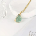 Gold-plated necklace with a raw green crystal pendant in an irregular natural shape - Fluorite
