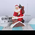 Resin Santa Claus climbing chimney figurine with gift bag for Christmas decor - Santa in Chimney Style A