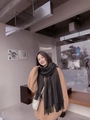 Dark green wool blend scarf with tassels shown in a stylish winter street style outfit - Coffee