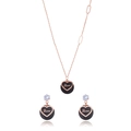Rose gold heart jewelry set featuring black circular pendants and sparkling white stones - Silver