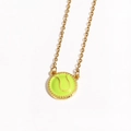 Detailed view of neon green tennis ball pendant with gold-tone chain for sports style - Tennis Ball / Gold