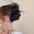 Close-up of a black organza hair tie with delicate feather accents for elegant styling - Black Bow Claw (Style 10)