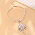 Macro detail of silver maple leaf pendant with rhinestones on white twisted rope - Silver Style (02 White K DZ-296)