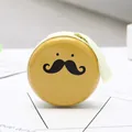 Round tinplate coin purse in yellow with mustache pattern and green zipper closure - Mustache Face Yellow Style 01