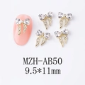 Macro shot of 9.5x11mm gold bow nail charm with crystal heart on pink manicure - Gold Clear Zircon (AB50)