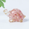 Pink and clear crystal turtle figurine with gold leaf fragments on white background - 08 Watermelon Quartz + Gold Foil