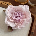 Elegant pink floral fabric hair claw clip shown in a vintage wooden tray display - Pink Purple Flower
