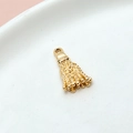 Macro shot of a shiny golden metal tassel pendant for DIY jewelry making on white ceramic - 03# Tassel